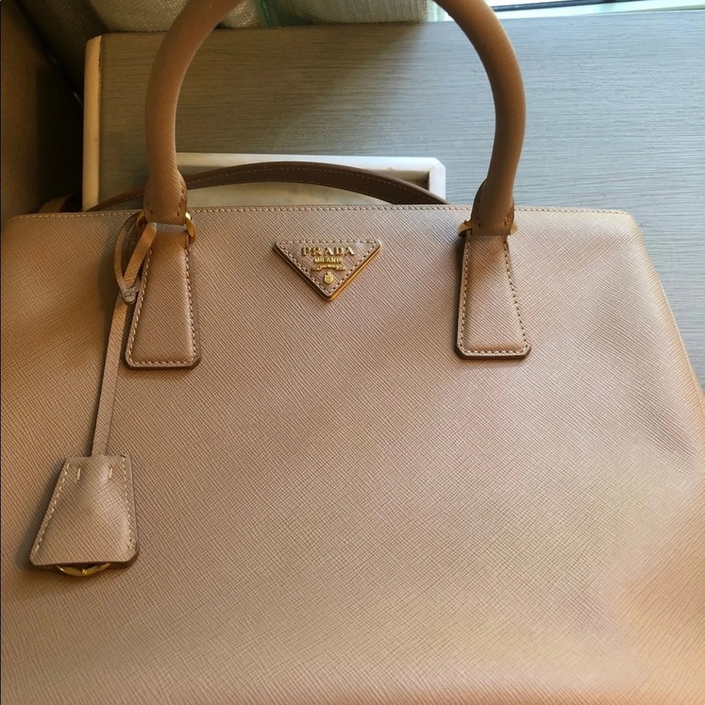 Prada authentic purse tan purse with dusted bag.
